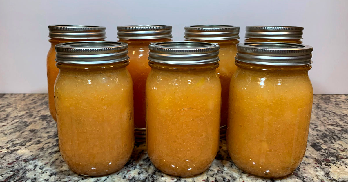 Seven Ball mason jars containing waterbathed applesauce