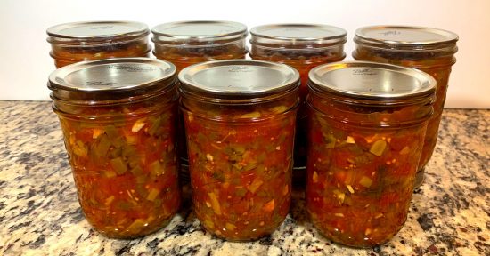 Seven Ball mason jars containing Zesty Salsa. Water Bath Canning Zesty Salsa.