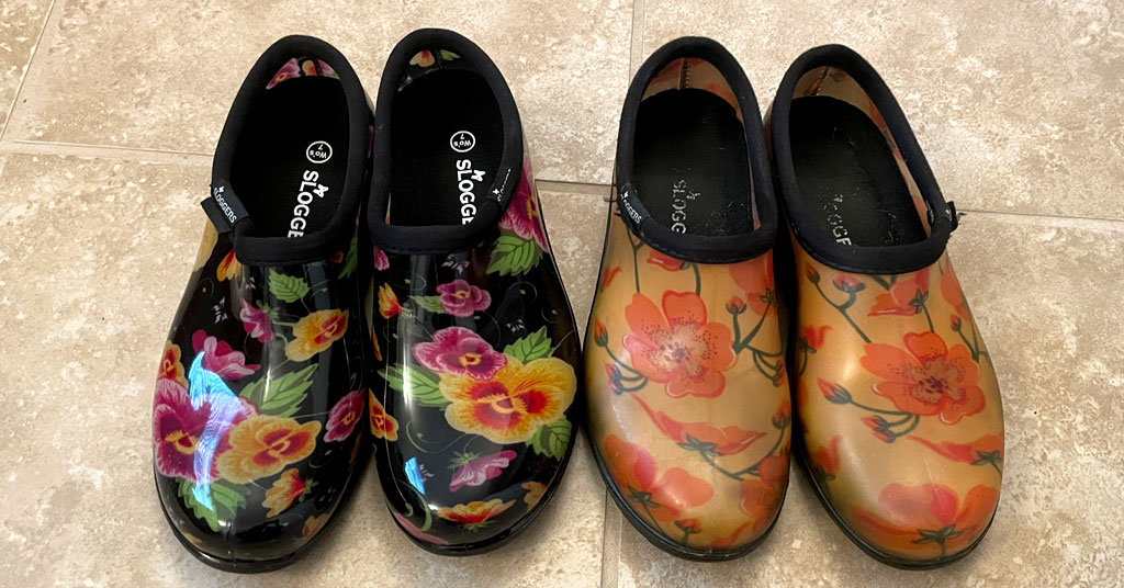 Garden shoes would be a fantastic gift for mom. Here are Two pairs of Sloggers garden shoes. One pair is yellow with orange flowers and the other pair is black with yellow and pink pansies.