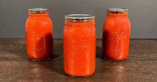 Water Bath Canning Tomato Sauce. Tomato sauce in three 1 quart mason jars